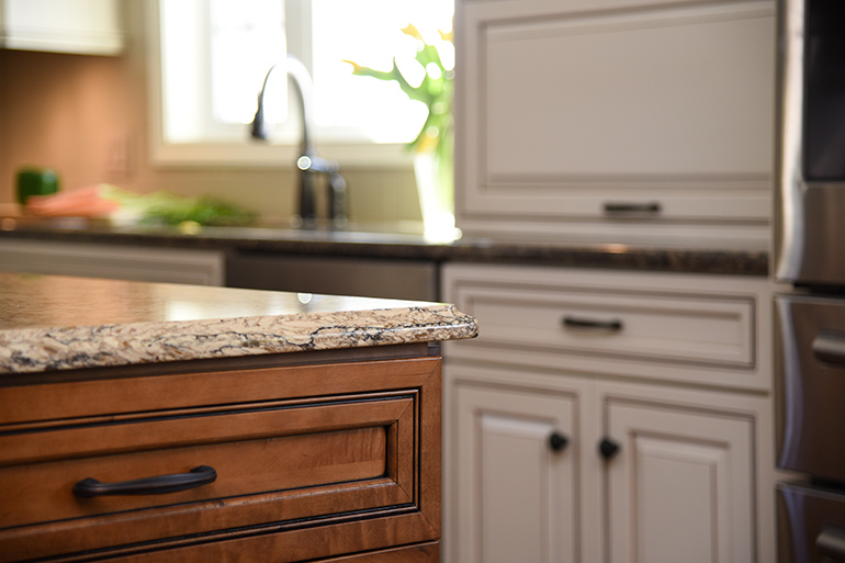 Contrasting Quartz and Cabinets - Two Tone Cabinets - Kitchen Cabinets - Details Full Service Interiors - Kitchen Renovation