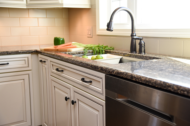 New Kitchen Sink - Bronze Faucet - Colander - Details Full Service Interiors - Kitchen Renovation