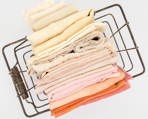 Neatly folded sheets and towels - At home projects