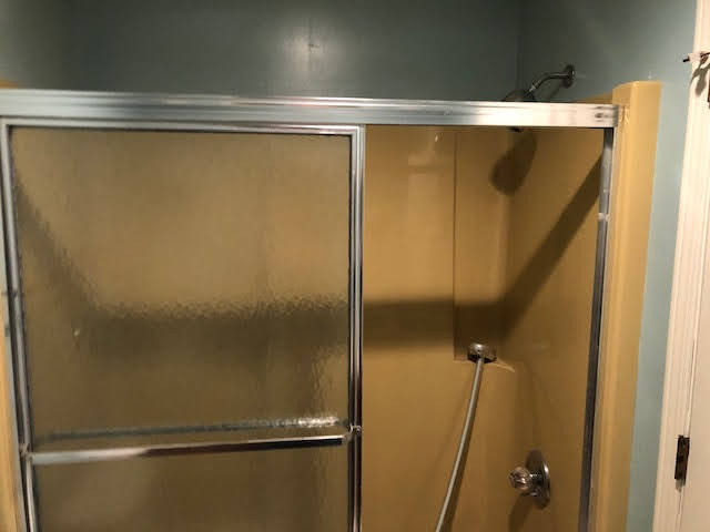 Original yellow tub shower combo - Behind the scenes of a practical bathroom remodel in Connecticut
