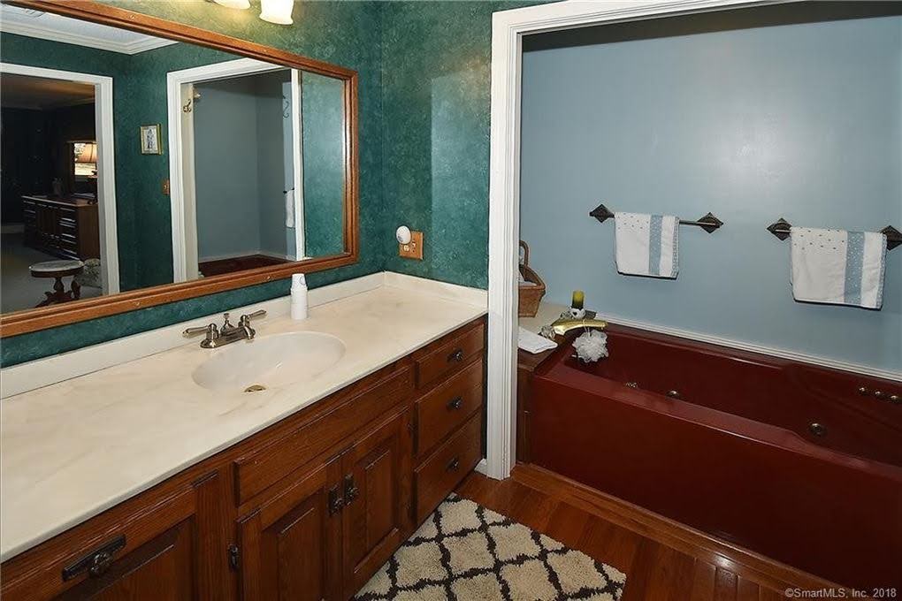Red bathtub and vanity - Remodeling Bathroom - CT Interior Design