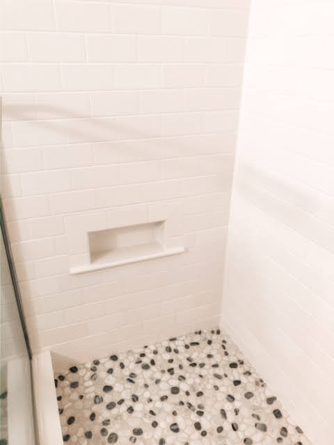 White subway tile shower with pebble floor and niche - Remodeling my Bathroom - Interior Design - Interior Decorating